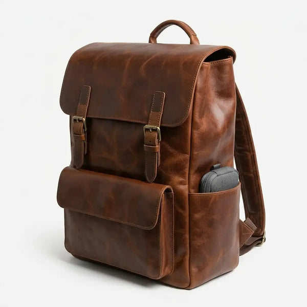 Brown leather backpack on a white background