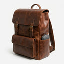 Brown leather backpack on a white background